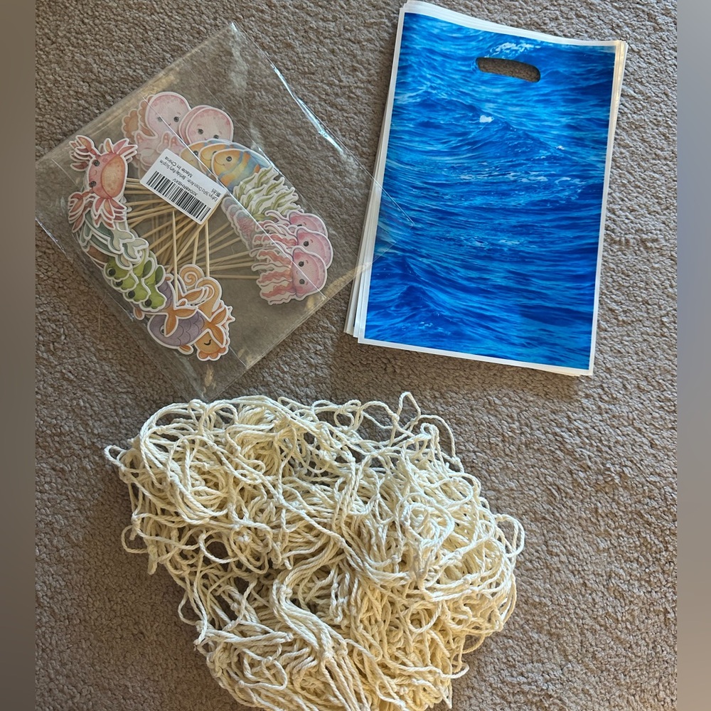 Under the sea toppers, fish net, and goodie bags